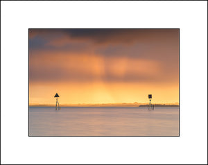 Spring sunset between the markers on Lough Neagh by John Taggart Landscape Photography