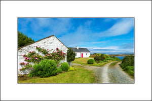 A beautiful little Irish Cottage beside the shore along the Wild Atlantic Way in County Donegal by John Taggart Landscapes