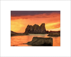 Sunset near Ballintoy across the sea stacks in County Antrim by John Taggart Landscape Photography