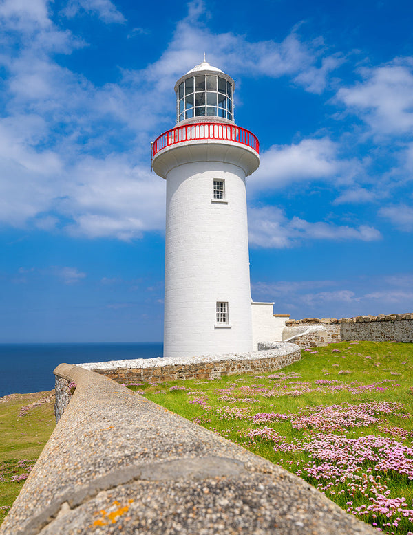 Historic Arranmore Lighthouse overlooking the Atlantic Ocean on Arranmore Island in County Donegal, Ireland.