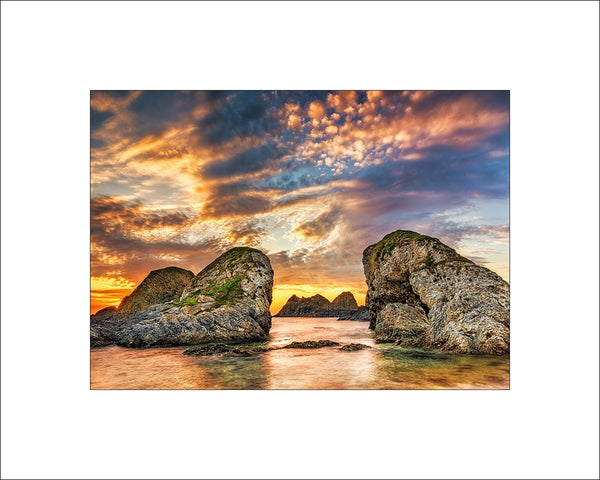 Just to the left of Ballintoy harbour towards White Park Bay is a lovely set of ancient rocks &amp; sea stacks that stand proudly for thousands of years and at various times of the year they catch the evening light and sunset, an absolute gem for the Landscape Photographer for their drama, mood and&nbsp;atmosphere.