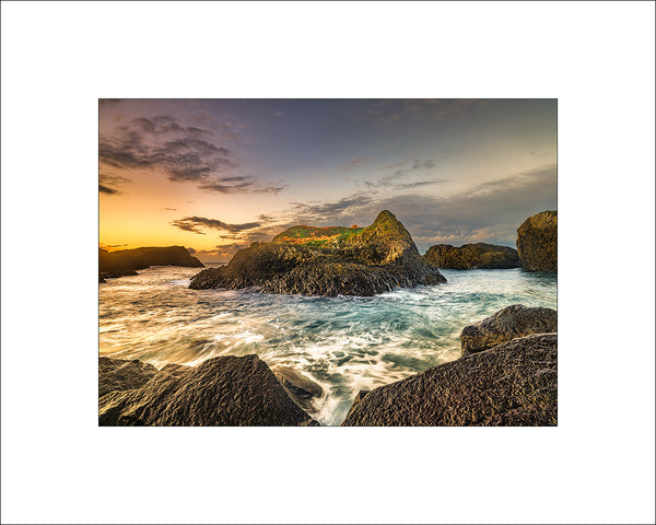 Waves among the sea stacks at Ballintoy Harbour on Ireland's north coast by John Taggart Landscapes.