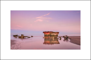 In&nbsp;1974 the MV Irish Trader&nbsp;ran aground on Baltray beach in Co. Louth Ireland. It was on route to Drogheda but never made it, and now lies rusting on the sand. The wreck is slowly disintegrating due to erosion and is accessible at low tide. By John Taggart Landscapes