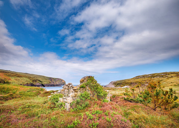 Ruins beside the coastline at Béal á Chraois on Arranmore Island in County Donegal along Ireland’s Wild Atlantic Way.