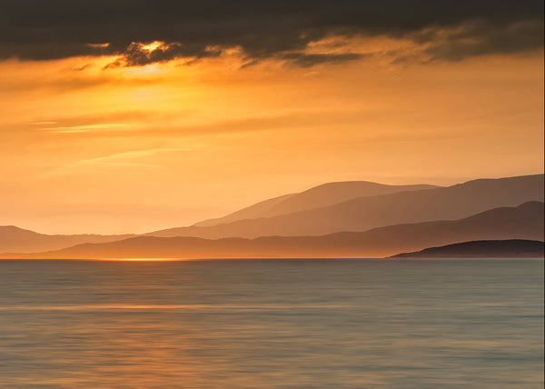 Golden sunset over Atlantic Ocean and mountains on the Beara Peninsula County Kerry Ireland landscape