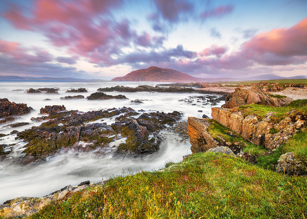 Binnion Hill in County Donegal with rocky Atlantic coastline at sunset
