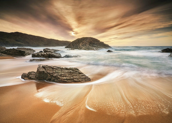 Donegal coastal sunset beach with long exposure waves flowing around rocks Irish landscape photography print