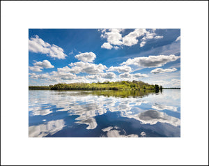 Carr Island reflected in Lough Erne County Fermanagh Northern Ireland on a beautiful spring day by John Taggart Landscapes
