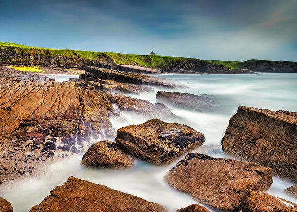 Rocky coastline at Classiebawn Castle Sligo Ireland with long exposure waves and textured foreground on the Wild Atlantic Way