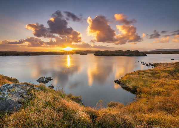 Connemara Sunrise - A beautiful autumn sunrise along the Old Bog Road in Connemara County Galway.
Bring the quiet magic of an Connemara autumn into your space with this fine art landscape photograph, captured in Connemara County Galway Reflected gently in calm water and surrounded by rich autumn foliage, the scene evokes stillness, nostalgia and the timeless beauty of the Connemara countryside.