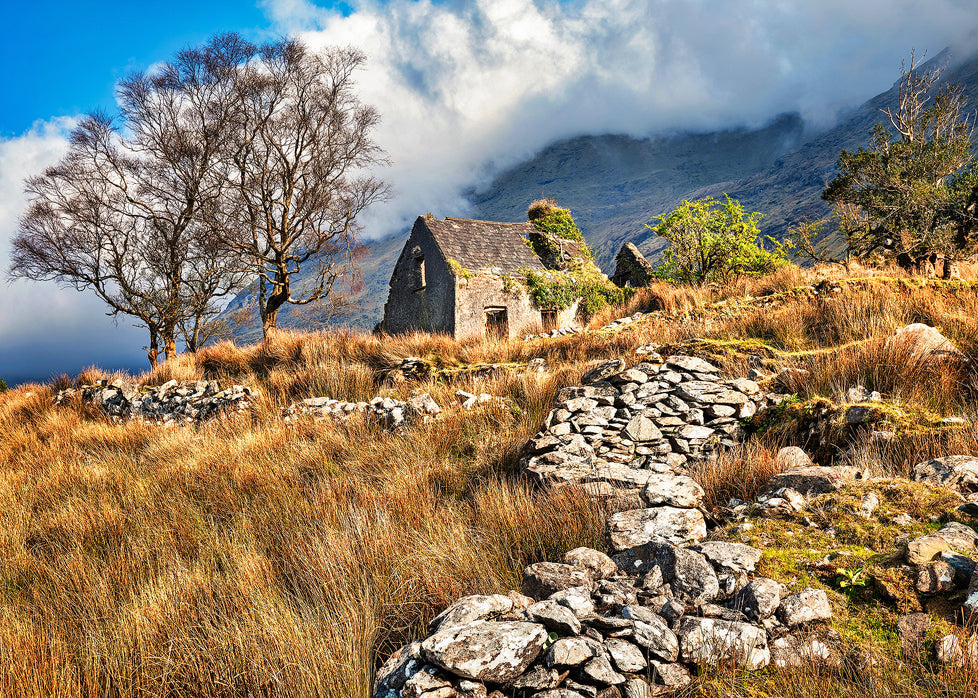 abandoned Irish cottage Drumluska County Kerry stone walls mountains dramatic clouds landscape photography