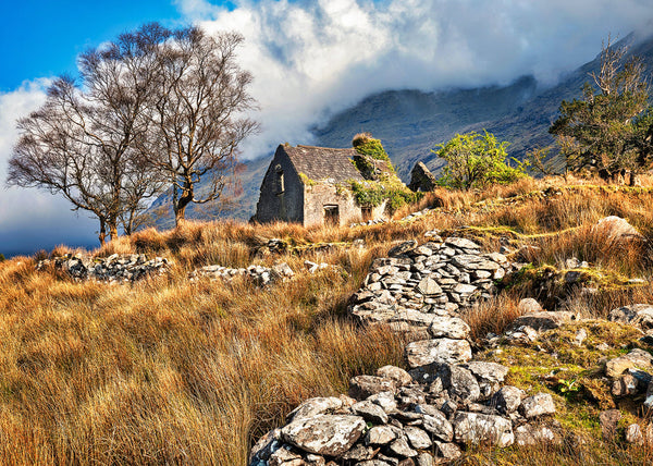 abandoned Irish cottage Drumluska County Kerry stone walls mountains dramatic clouds landscape photography