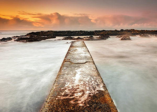 Dunseverick Pier sunset long exposure County Antrim Northern Ireland coastal landscape print golden sky rocky shore