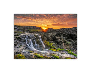 Sunset at Dunseverick Waterfall on the Causeway Coast in County Antrim by Irish landscape photographer John Taggart