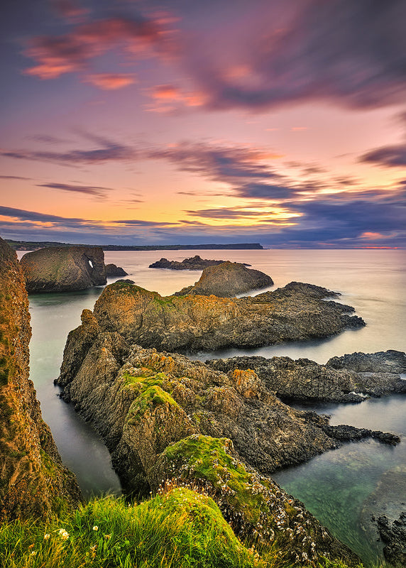 Ballintoy Coast sunset with rugged rocks and calm sea, County Antrim Ireland landscape photography