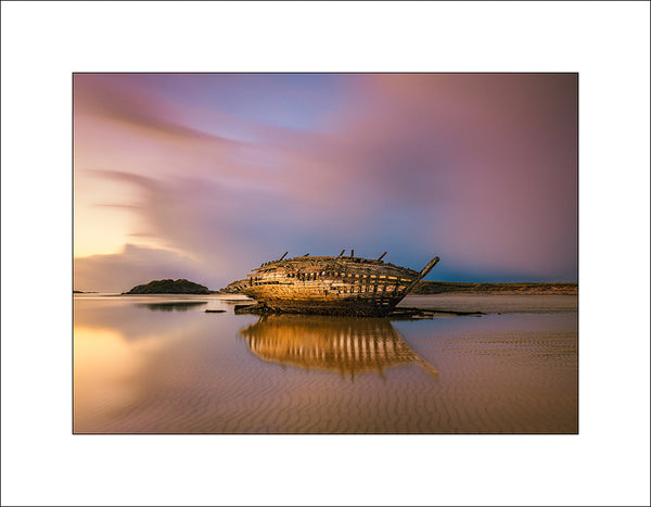 Locally named as Bád Eddie or Eddie's boat sits on Magherclogher Beach Bunbeg, Gweedore County Donegal. By John Taggart Landscapes