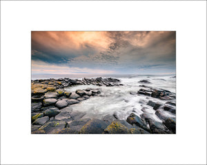 Evening light across the stones at the Giants Causeway in County Antrim by John Taggart Landscapes