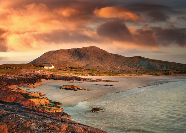 Glassillaun Beach Connemara sunset with white sand, cottage and mountain Ireland Wild Atlantic Way