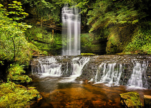 Glencar Falls waterfall in County Leitrim Ireland surrounded by green forest landscape photography print.
