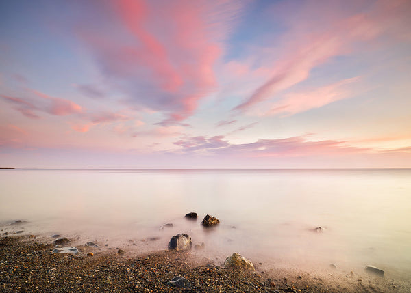 Irish Sea sunrise long exposure with pink clouds and pebbled shoreline fine art print