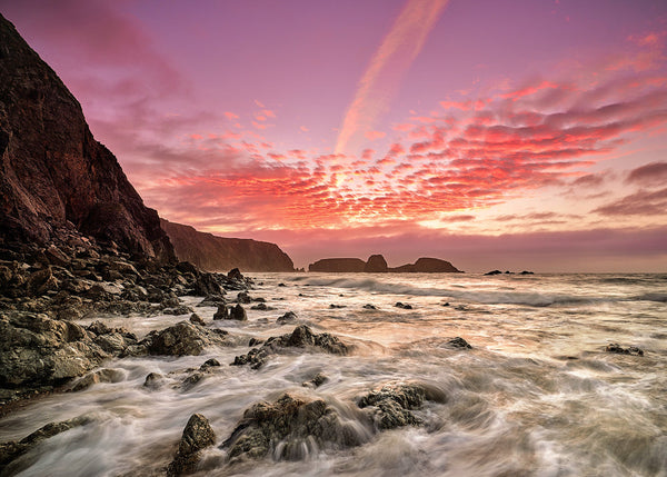 Kilfarrasy Beach Waterford dawn red sky long exposure waves rocks Ireland seascape