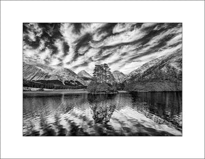 A small &nbsp;lochan located in Glen Etive in the Scottish Highlands near Glencoe which is sheltered by the high sided mountains of Buachaille Etive Beag and Buachaille Etive Mor. Photography by John Taggart Landscapes