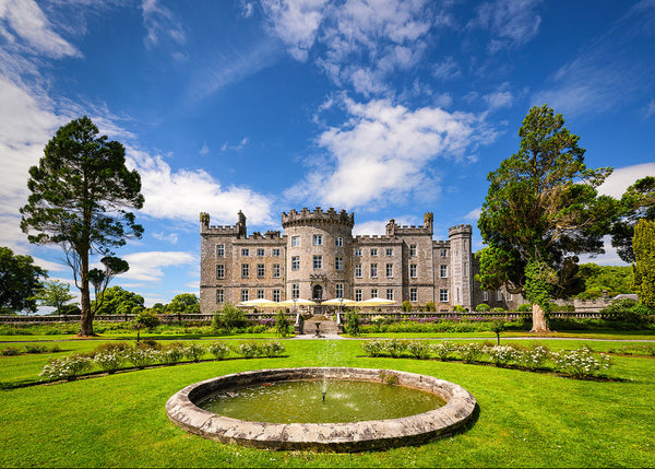The stunning grounds and towers of Markree Castle which sits on the River Unshin in Collooney in County Sligo against a summer sky.