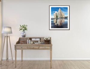 Striking architectural photography of Titanic Belfast, captured with perfect reflection and crisp detail under a blue sky. This iconic image from Northern Ireland showcases the modern design and cultural significance of Belfast's Titanic Quarter. A fine art print by John Taggart Landscapes, ideal for home or office decor.