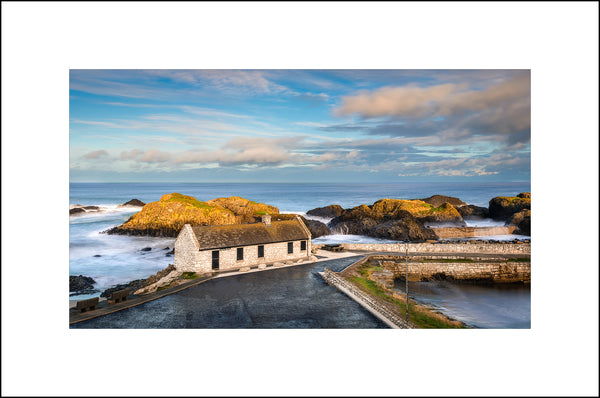 Roorks Kitchen Cottage at beautiful Ballintoy Harbour in County Antrim by John Taggart Landscapes