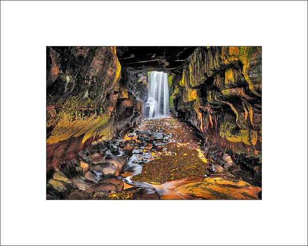 The sea cave and waterfall in beautiful County Donegal along the Wild Atlantic Way by Irish Landscape Photographer John Taggart