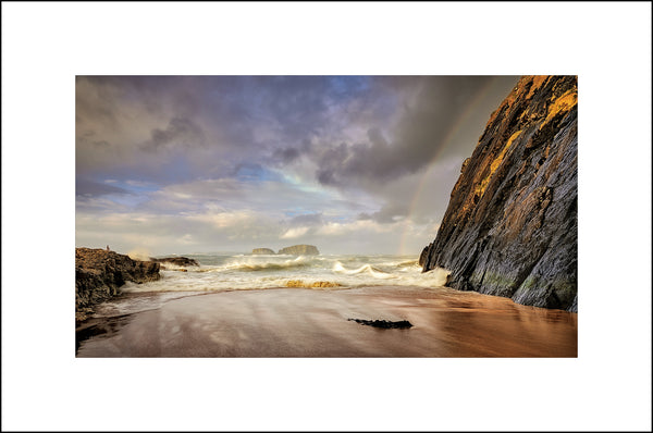 Stormy evenings and beautiful rainbows at Ballintoy overlooking Sheep Island by John Taggart Landscapes