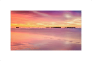 The Skerries are a small group of rocky islands just off Portrush on the north coast of Ireland by John Taggart Landscapes