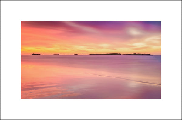 The Skerries are a small group of rocky islands just off Portrush on the north coast of Ireland by John Taggart Landscapes