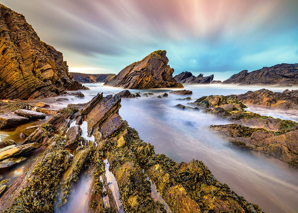 Slea Head Dingle Peninsula Ireland coastal landscape with rugged rocks and flowing Atlantic water