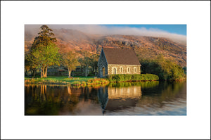 Beautiful morning light at St Finbarrs Oratory at Gougane Barra [Irish: Guagán Barra, meaning 'the rock-cleft of Barra') is a scenic valley and heritage site in the Shehy Mountains of County Cork, Ireland by John Taggart Landscapes