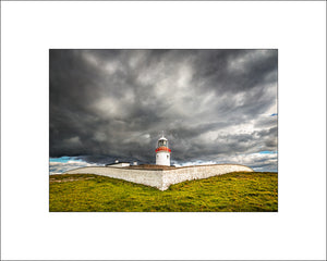 Stormy light on St John's Point Lighthouse near Dunkineely in County Donegal by Irish Landscape Photographer John Taggart