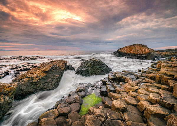 Evening light across the stones at the Giants Causeway in County Antrim