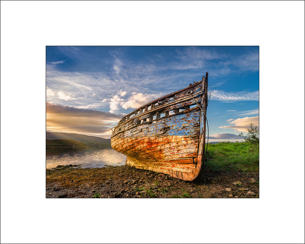 The old boat The Mary Buchan at sunset in Mulroy Bay in County Donegal by Irish Landscape Photographer John Taggart