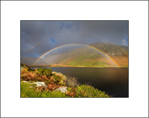 Annascaul Lake and rainbow on the Dingle Peninsula in Co Kerry Ireland by Irish landscape photographer John Taggart 