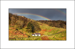 A rainbow over the abandoned cottage on Murlough Bay Co Antrim Northern Ireland by John Taggart Landscapes