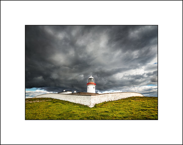 Stormy light at St Johns Point Lighthouse near Dunkineely in Co Donegal Ireland by John Taggart Landscapes