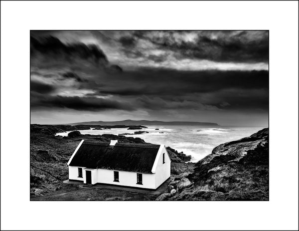 Black & white fine art landscape photography of an Irish thatched cottage on the Wild Atlantic Way in Donegal Ireland