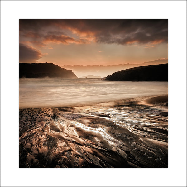 Sunset at Clogher Strand Co Kerry Ireland by by Fine Art Landscape Photographer John Taggart